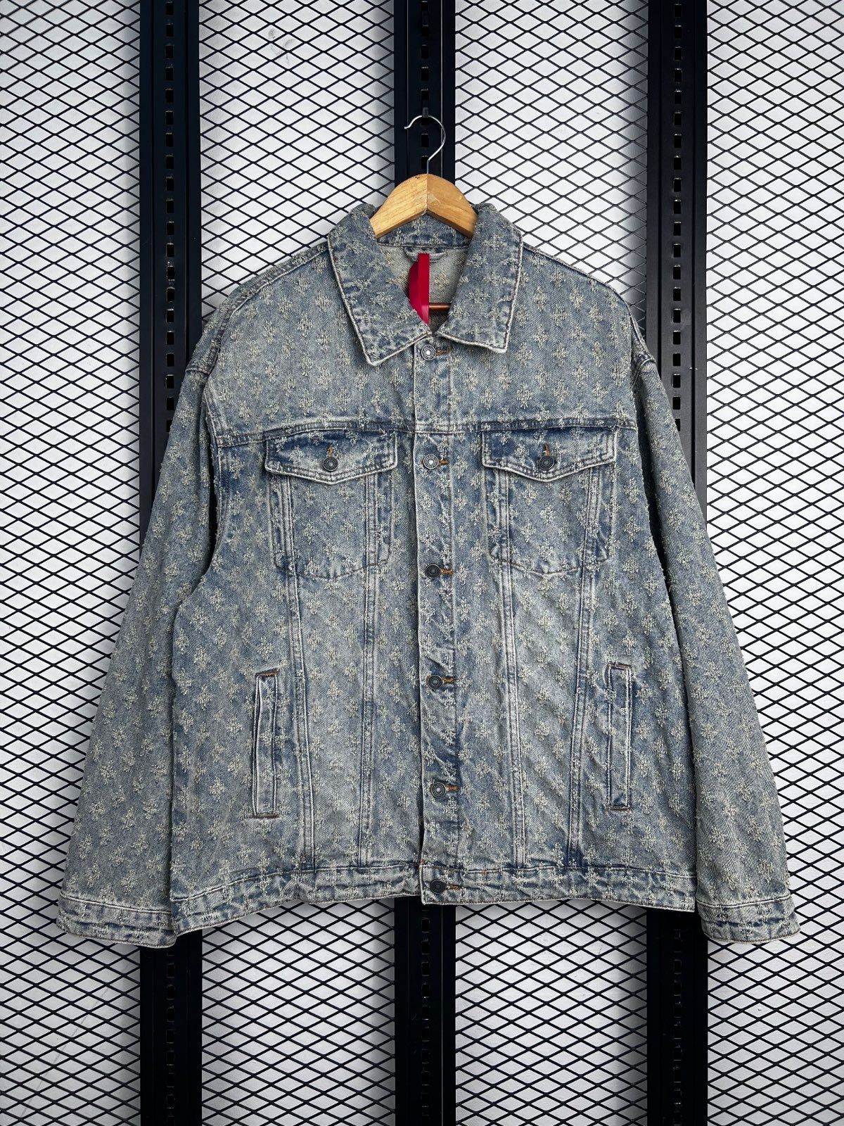 Boxy trucker silhouette in distressed monogram-jacquard denim