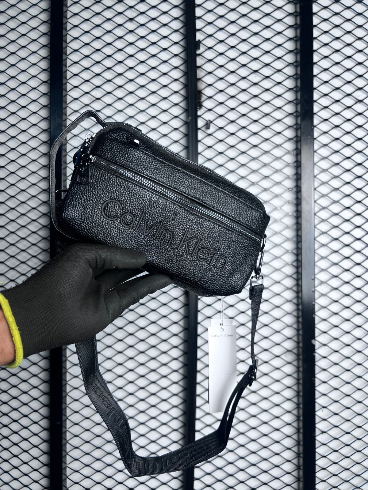 Black pebbled faux-leather toiletry pouch with front zip