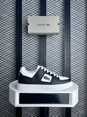 Textured leather low-top in black and white on a cup sole with a casual finish