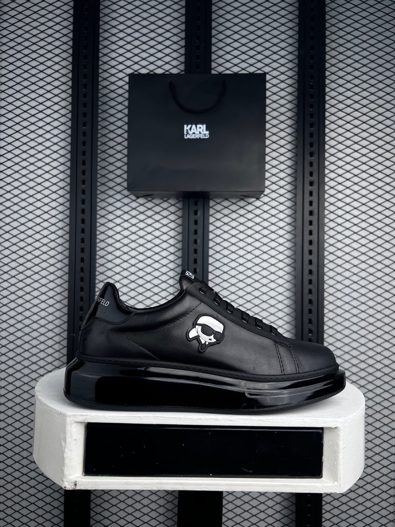 Black leather platform low-top with side figure patch