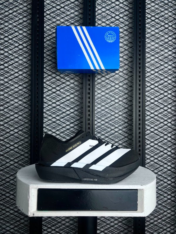 Black mesh racing shoe with oversized white angled stripes
