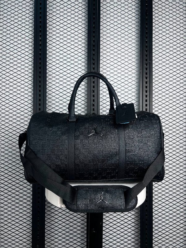 Twin-handle weekend duffle in embossed black monogram