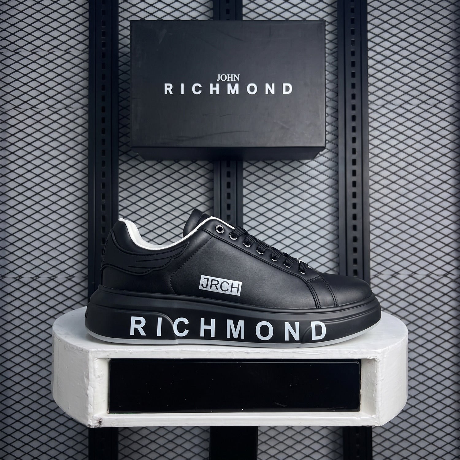 Black leather platform sneaker with white collar