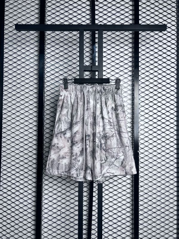 Muted woodland camo drawstring shorts with elastic waistband