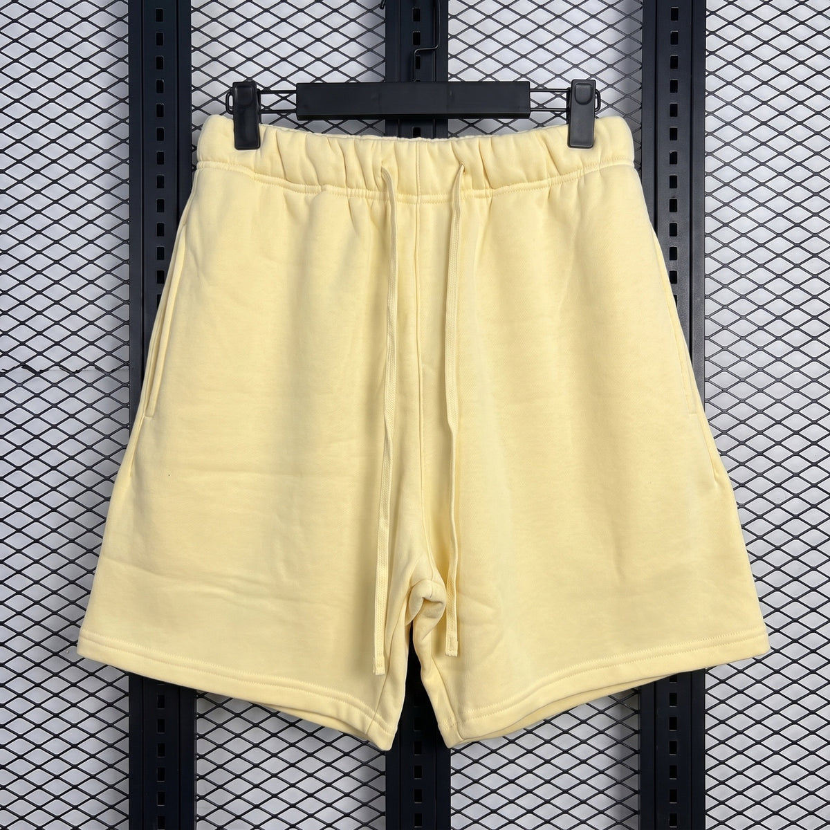 Fleece drawstring sweat shorts in pale pastel yellow