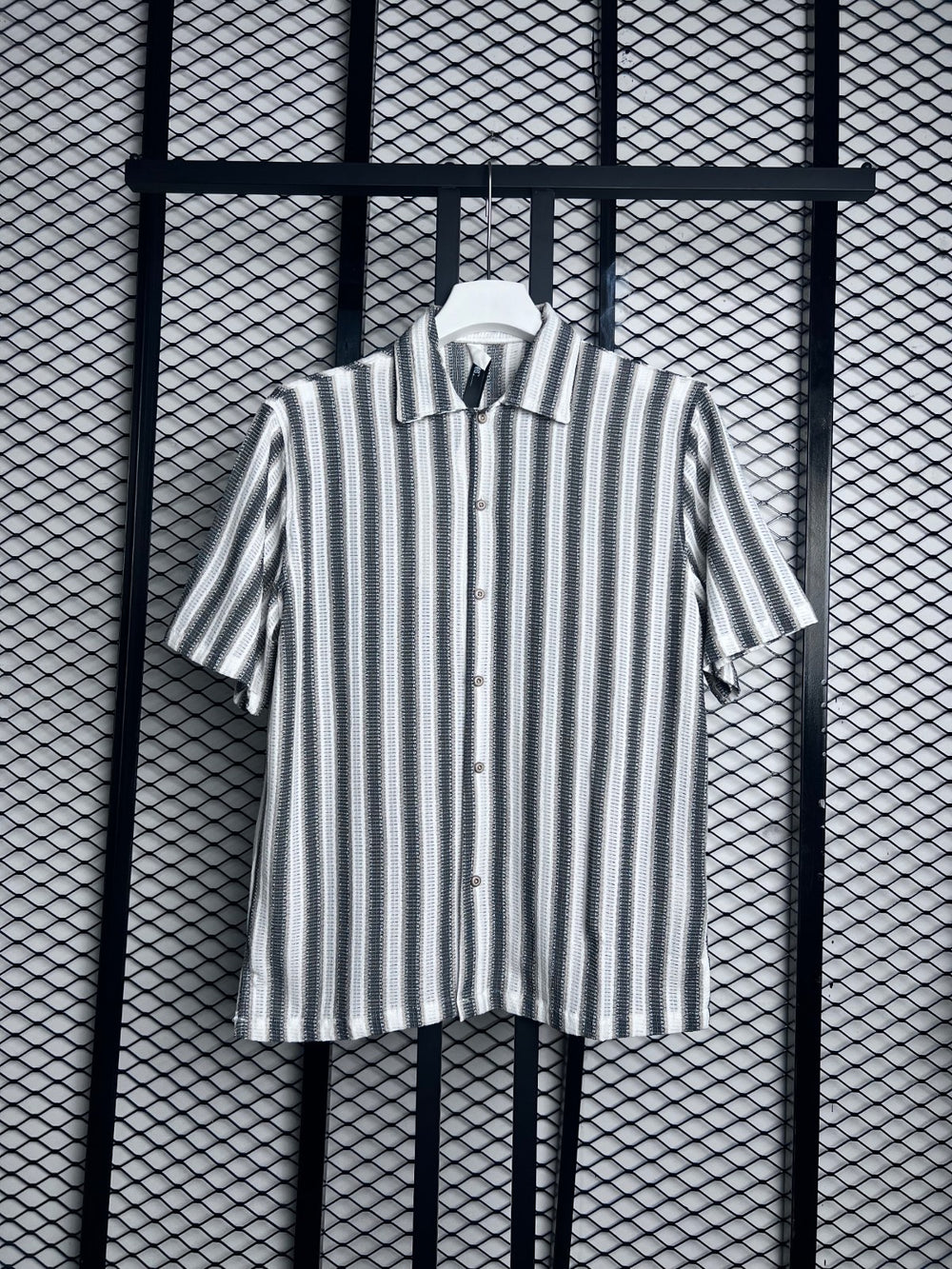 Short-sleeve camp collar silhouette in vertical textured stripe