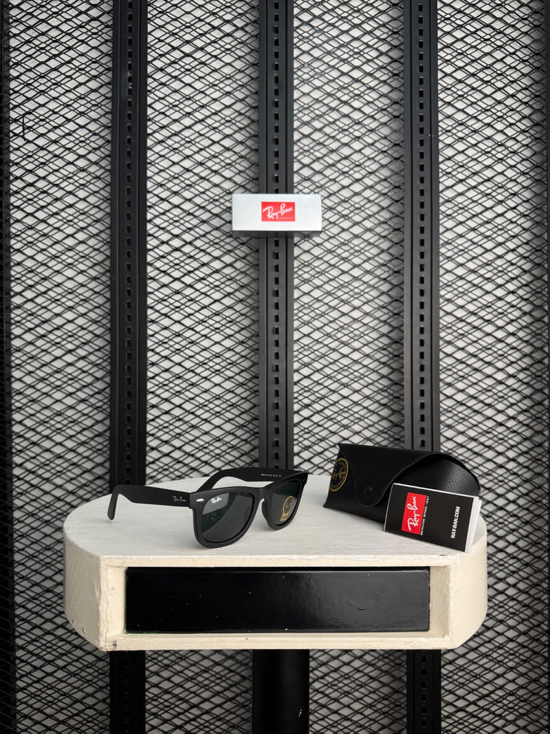 Matte black square sunglasses with dark green lenses
