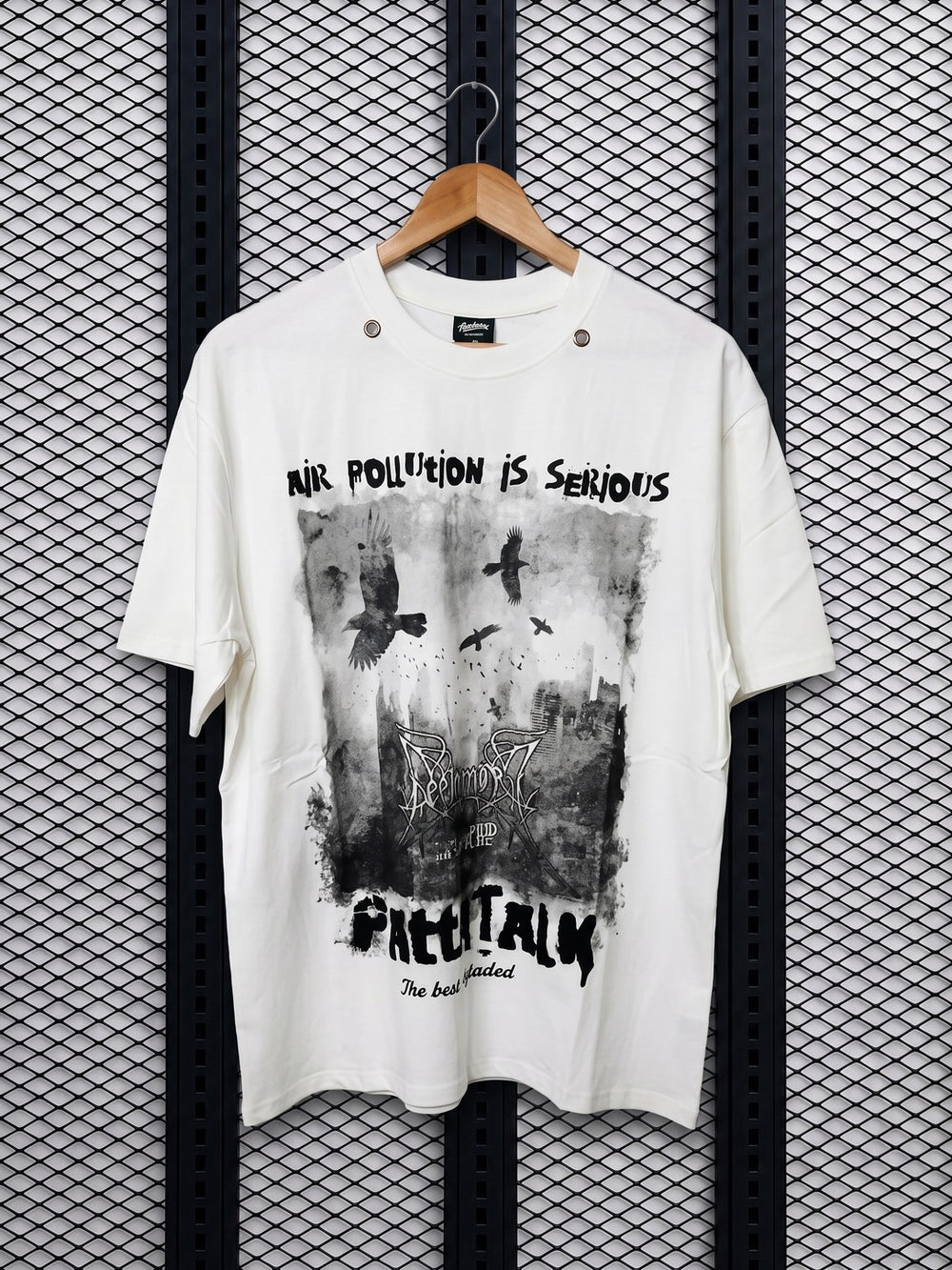 Cream graphic tee with metal eyelet collar detailing